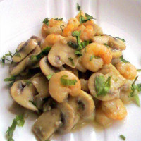 Langostino con champiñones